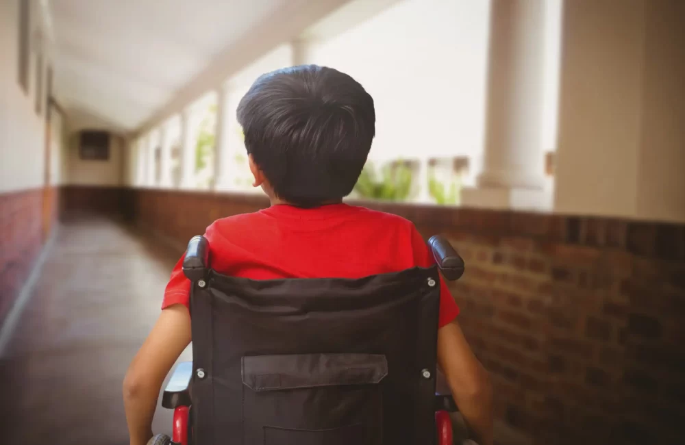 Digital composite of Disabled boy in wheelchair